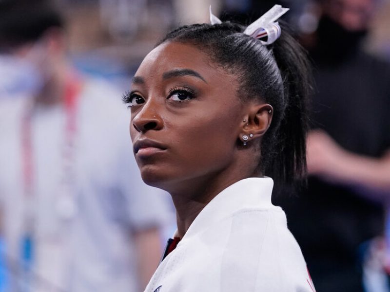 Simone Biles, of the United States, waits for her turn to perform during the artistic gymnastics women's final at the 2020 Summer Olympics, Tuesday, July 27, 2021, in Tokyo. (AP Photo/Gregory Bull)